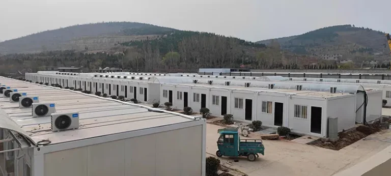 Rows of modular workforce accommodation buildings at a remote project site