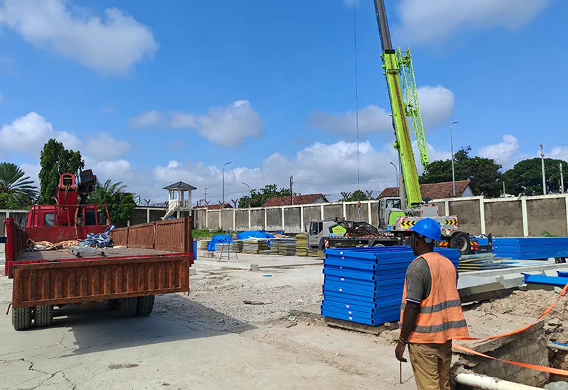 Crane lifting prefabricated modules during construction project installation