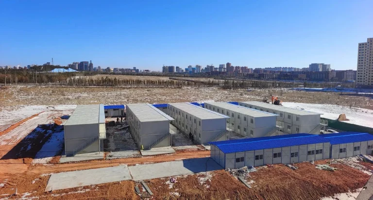 Aerial view of modular accommodation blocks in a shared construction camp