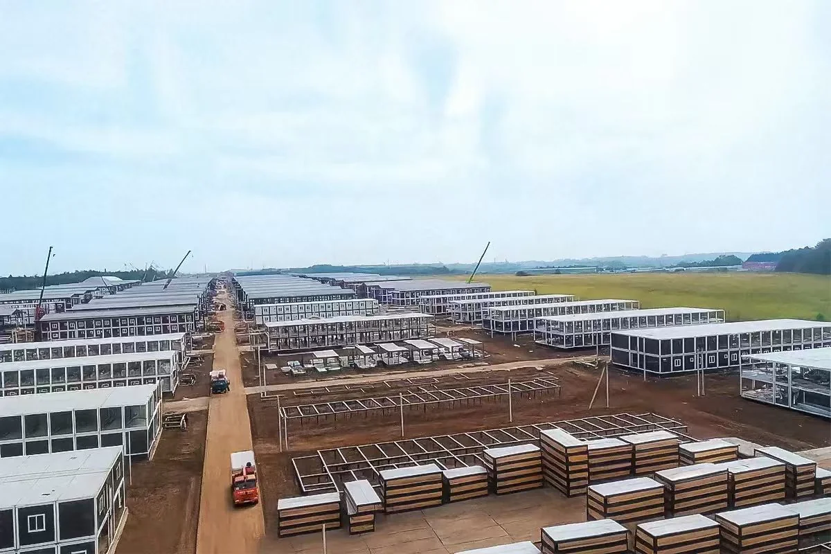 KUBO modular camp under phased construction with completed blocks and building frames