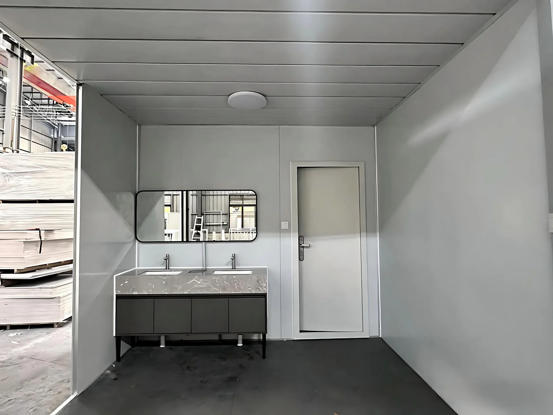 Centralized modular washroom interior with twin hand basins for workforce accommodation