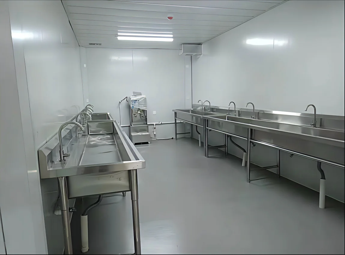 Stainless steel handwashing area inside a modular camp sanitary facility