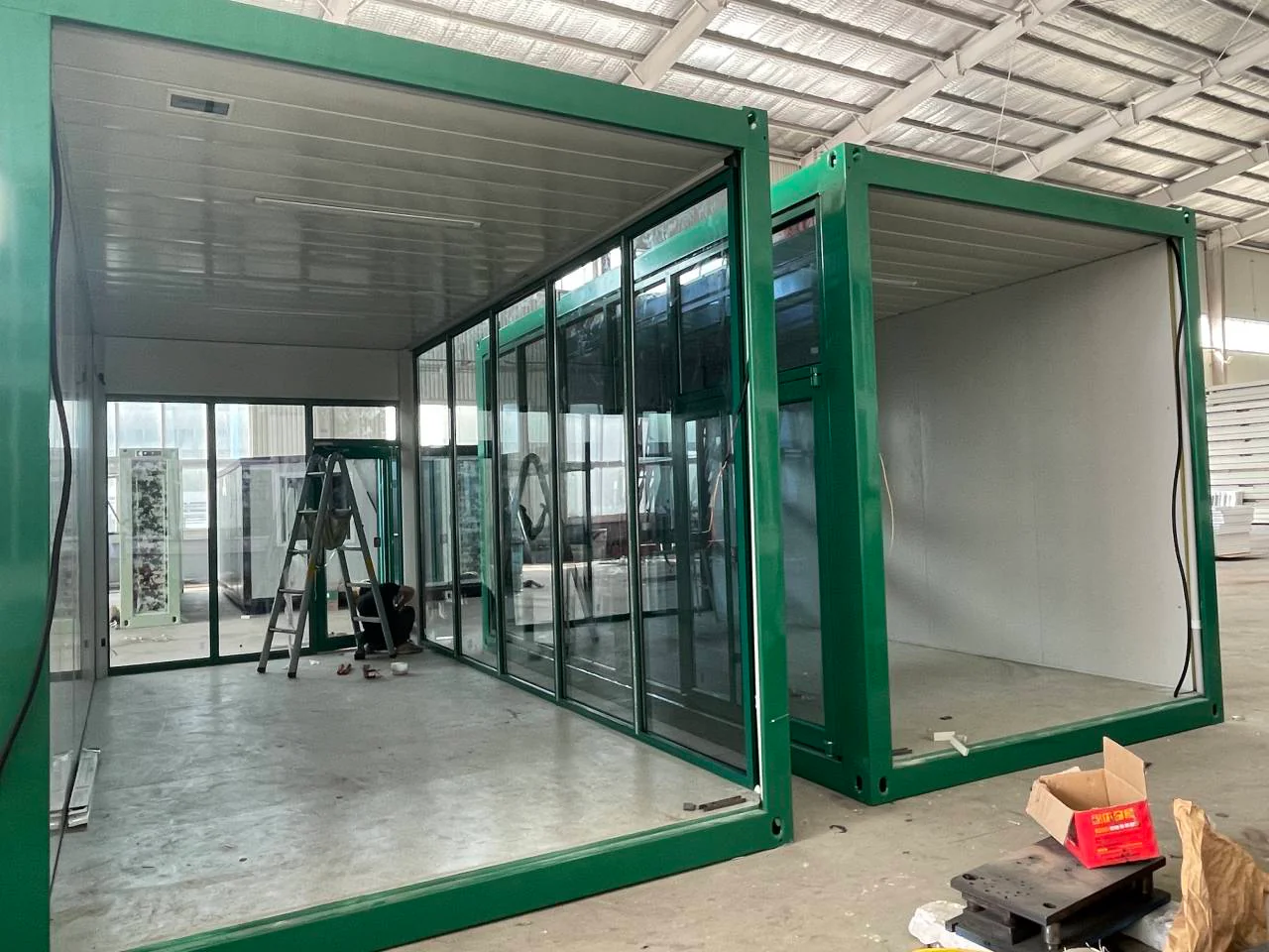 KUBO commercial modules during factory fit-out with open storefront and service interfaces
