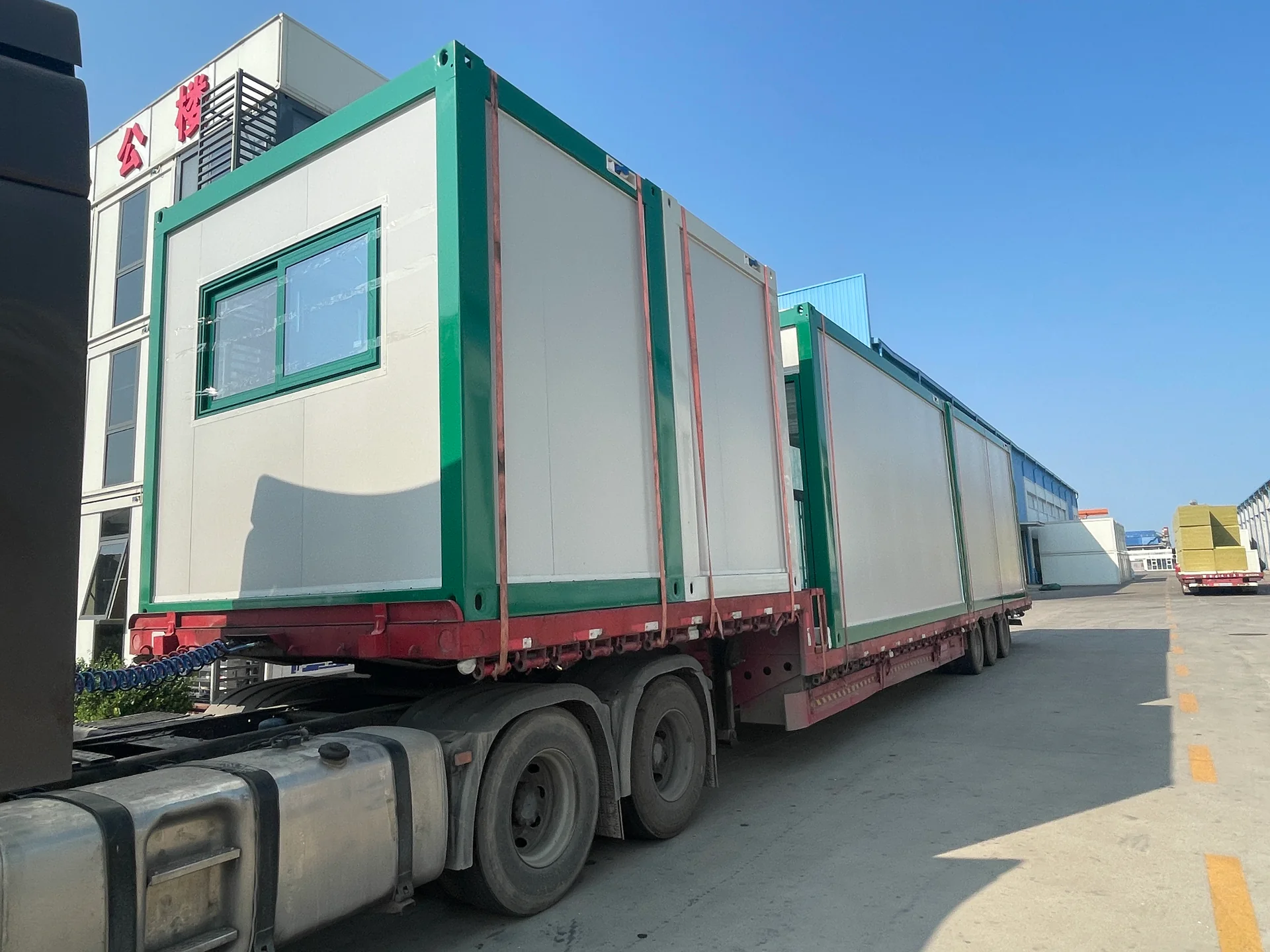 KUBO modular retail units secured on a trailer for transport to site