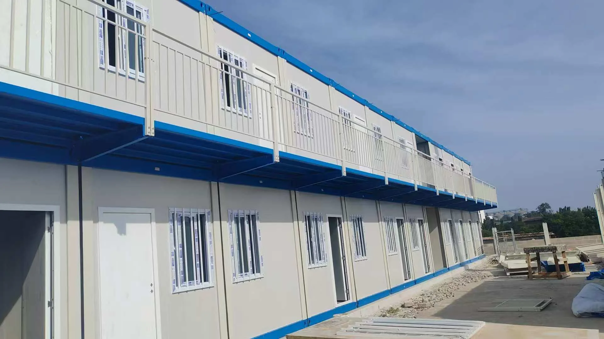 Two-storey modular project building during phased site installation