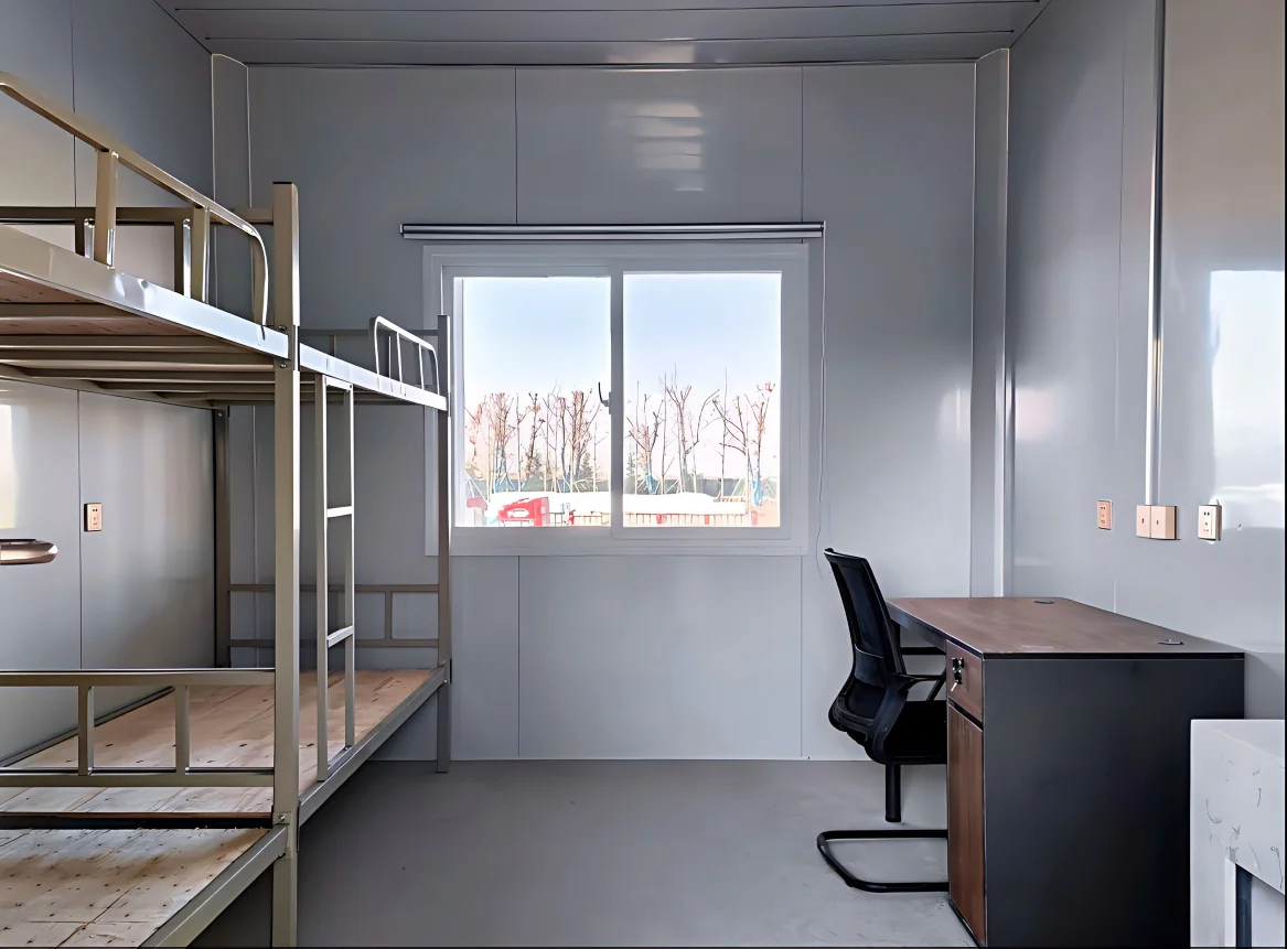 Interior of a prefabricated worker dormitory room with bunk beds