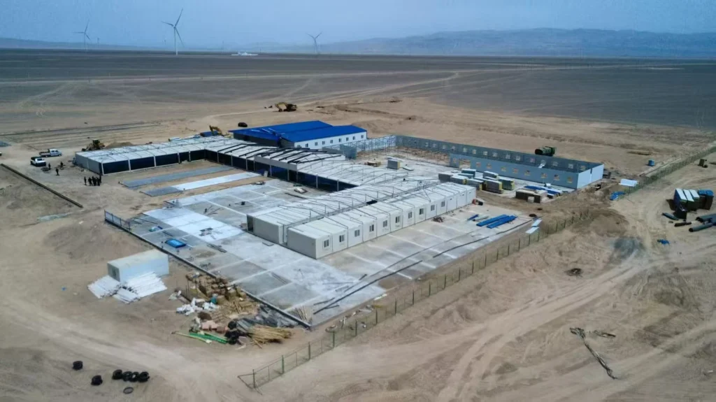 Aerial view of a modular construction camp on a dry, remote site