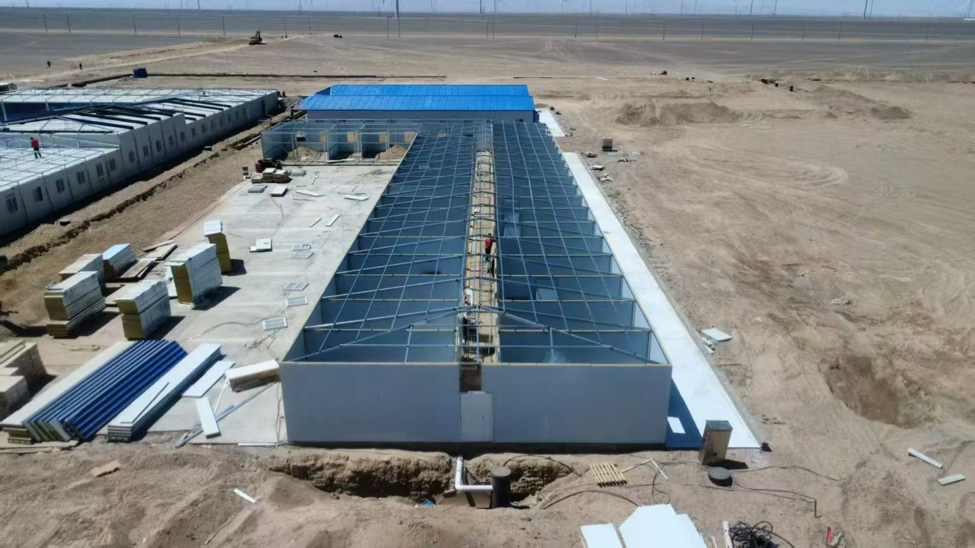 Modular camp buildings under installation at a remote arid project site