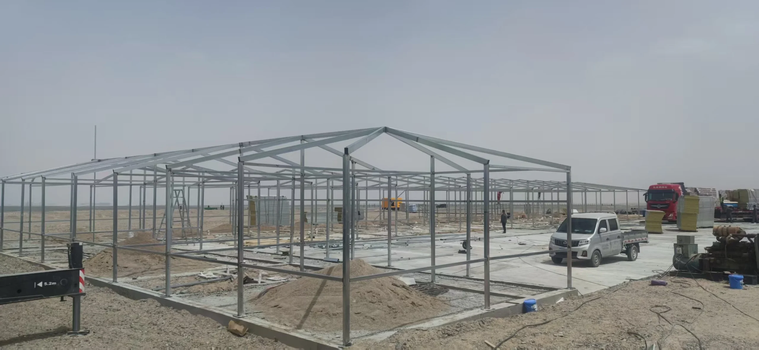 Steel frames for modular workforce buildings under construction on a remote site
