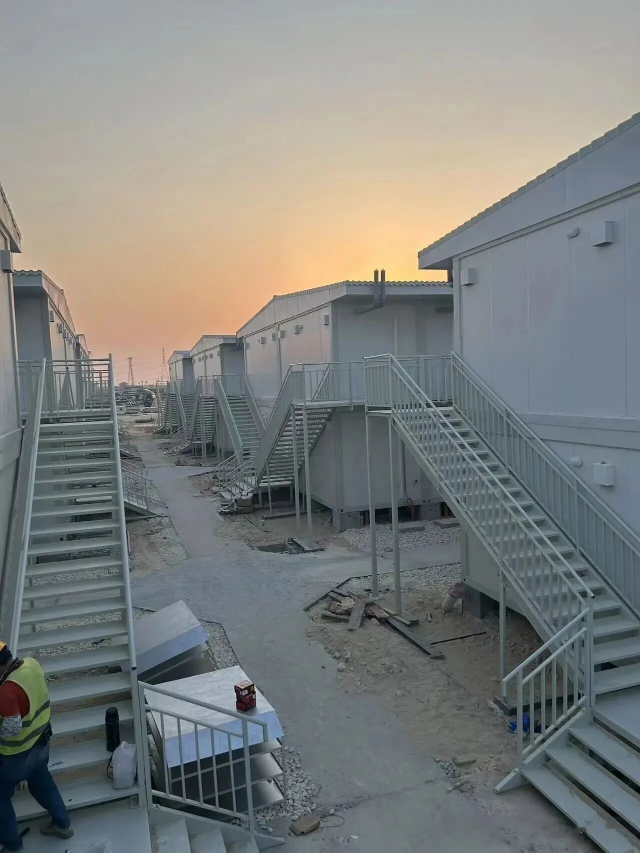 External stairs and elevated walkways during modular camp installation