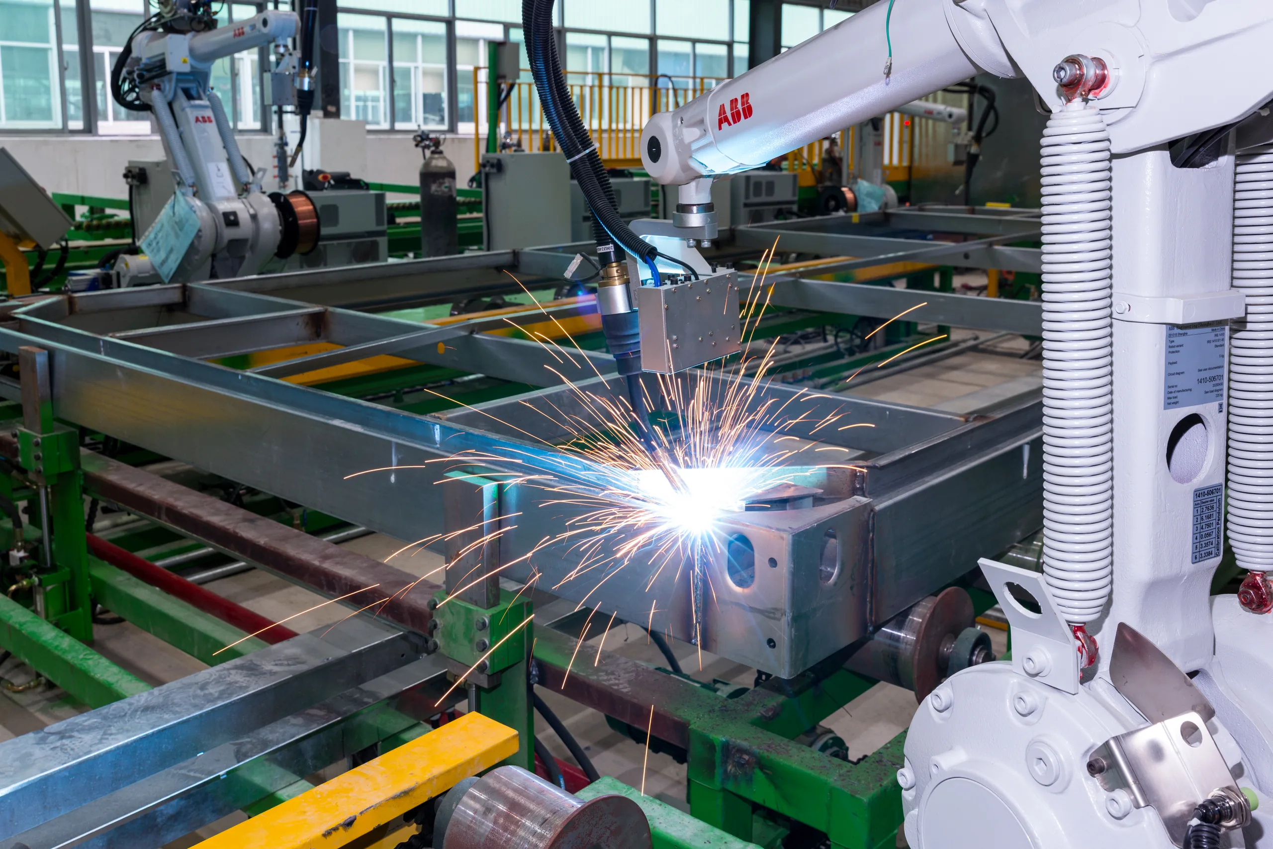 Robotic welding of a KUBO modular steel frame with perimeter members and crossmembers visible