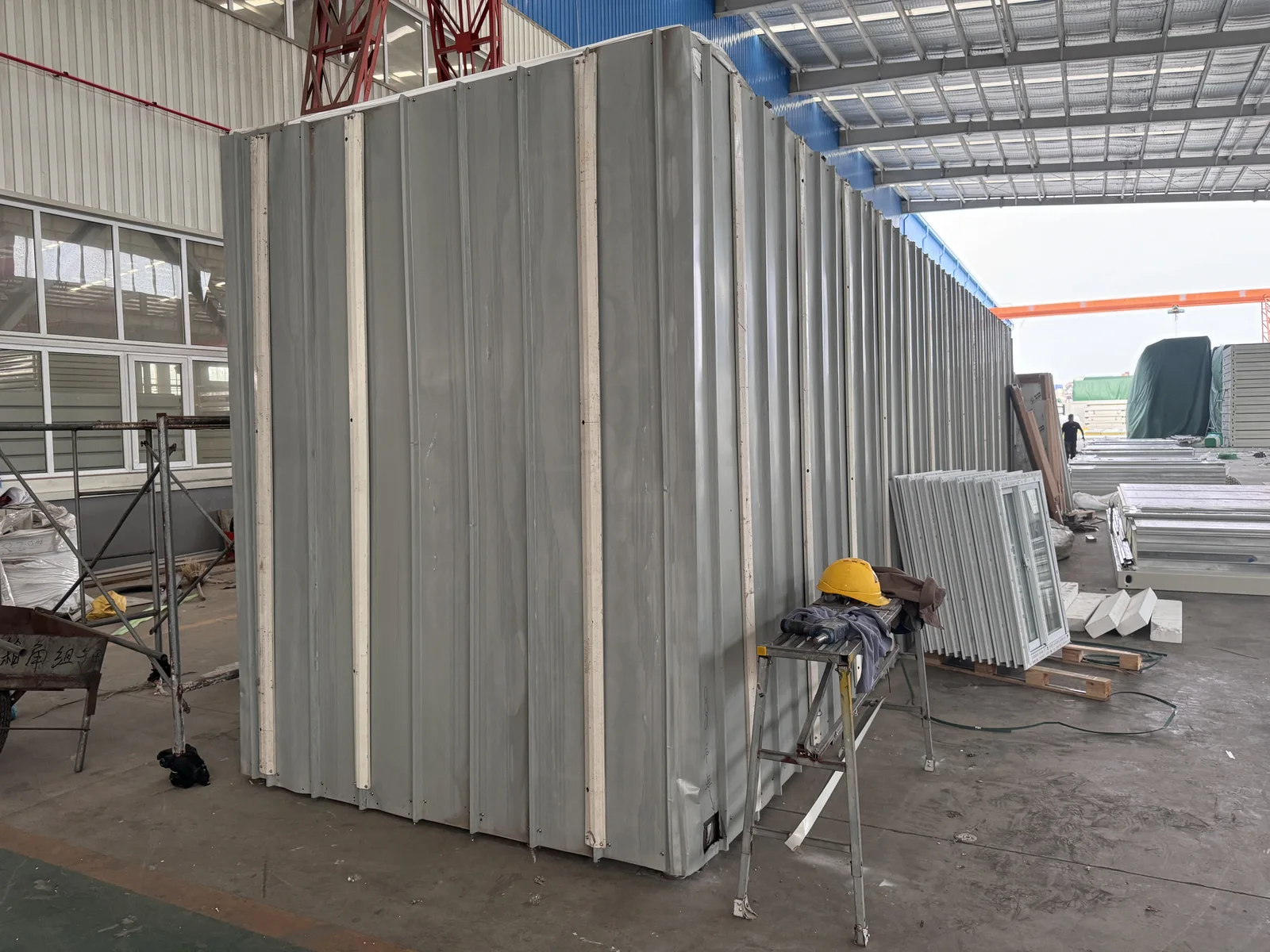 KUBO wall and enclosure panels staged in the factory before packing