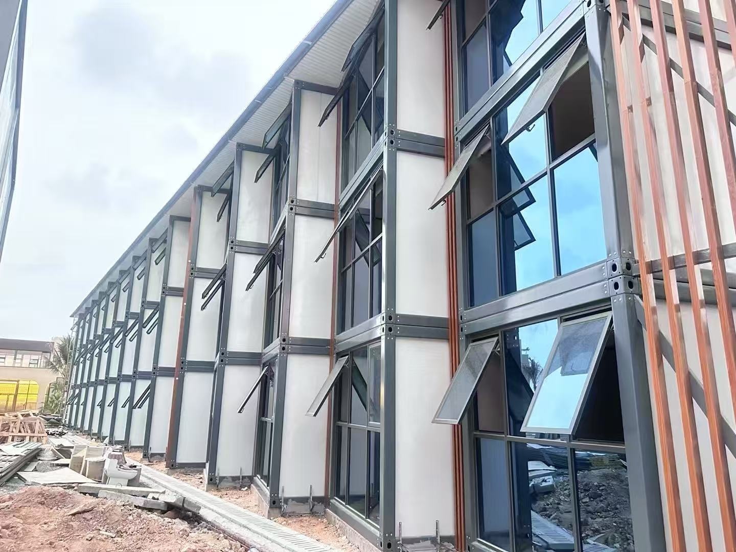 Construction-stage facade of the three-storey Cambodia modular container hotel