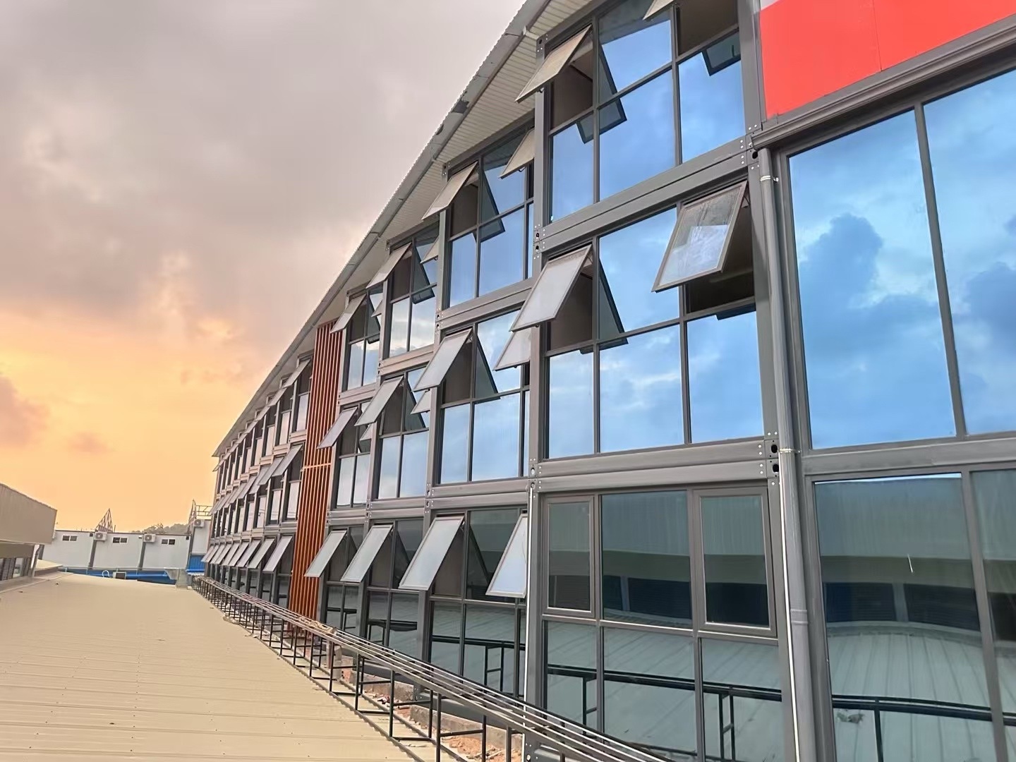 Angled construction-stage view of the Cambodia modular container hotel facade